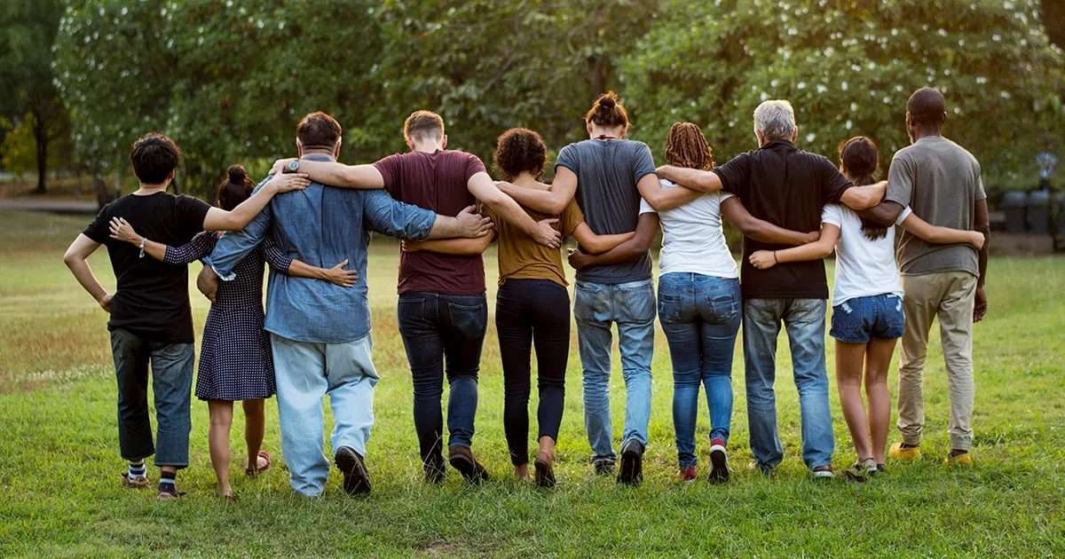 community of people holding eachother